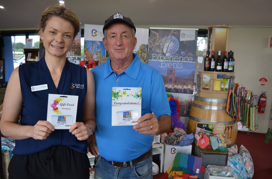 CARD-CARRYING: Tourism marketing co-ordinator Phoebe Rhodes and mayor Bobby Bourke at Bathurst Visitor Information Centre.