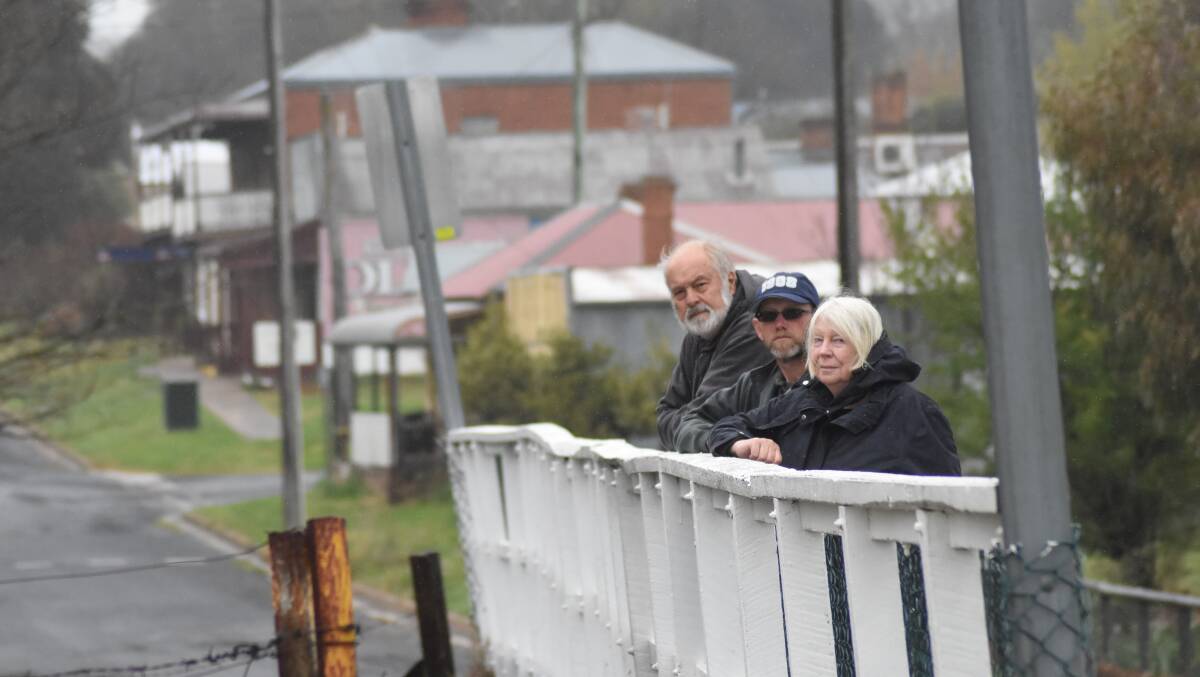 NEW BRIDGE WIN: Wayne Moore, David Lake and Pam Moore are pleased to hear that common sense has prevailed when it comes to an appropriate diversion. Photo: MARK LOGAN