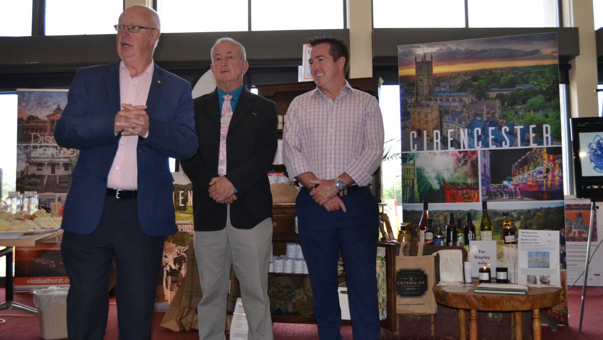 EXCHANGE: Councillor Graeme Hanger, mayor Bobby Bourke and Bathurst MP Paul Toole at the launch of the Cirencester display at the Bathurst Visitor Information Centre.