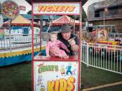 Chippa Chant, owner of Chant's Amusements, and his granddaughter Cherry Chant at Bathurst Showground. Picture by James Arrow.