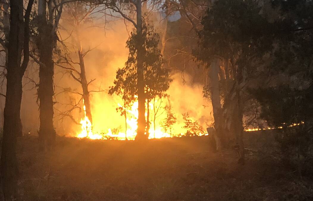 CRISIS: The Palmers Oaky bushfire, between Mudgee and Lithgow, is one of many that have been burning in NSW. Photo: DAVE PEIME