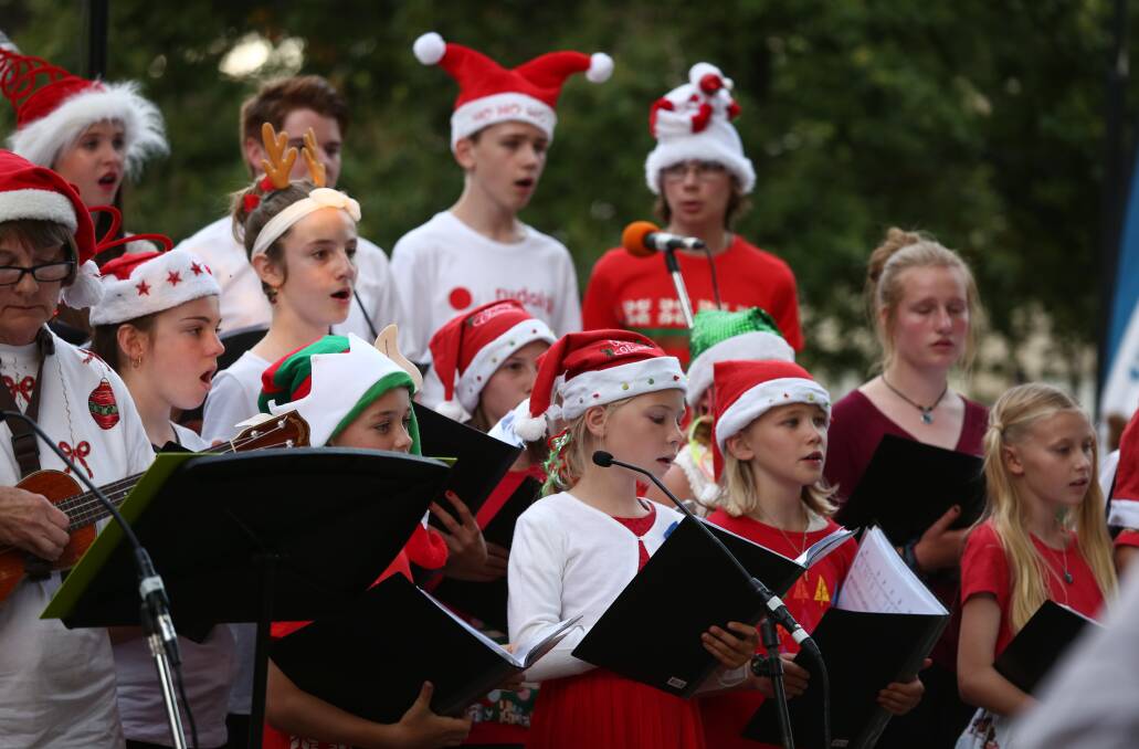SING OUT LOUD: The 2015 Carols By Candlelight in Machattie Park was filmed by Bruce Ryan for the popular Bathurst Remembers series. Photo: PHIL BLATCH 121315pbcandle90