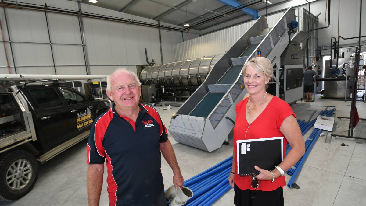 FRESH START: David Pennells of Inland Building and Construction with Glenray general manager Kath Graham. The tunnel washer in the background. Photo: CHRIS SEABROOK