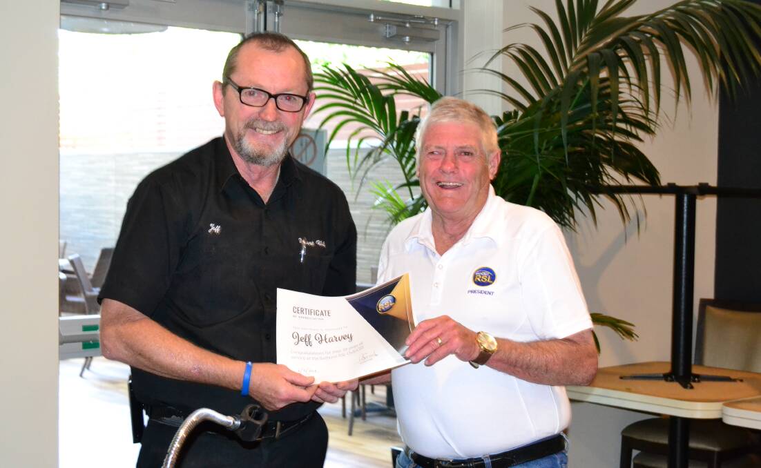 WELL DONE: Bathurst RSL Club president Ian Miller (right) recognises Jeff Harvey for his 39 years of service with the club. 120618RSL