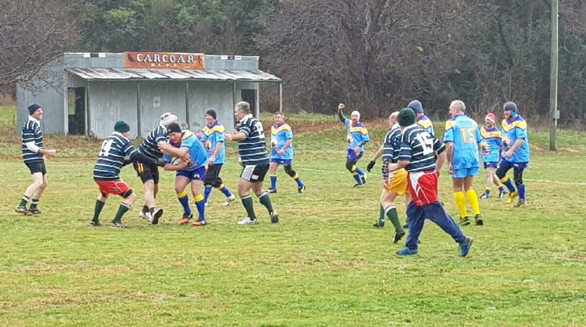 THEY WERE GAME: The Bathurst Old Bulls and Orange Emulators played at Carcoar recently in freezing temperatures.