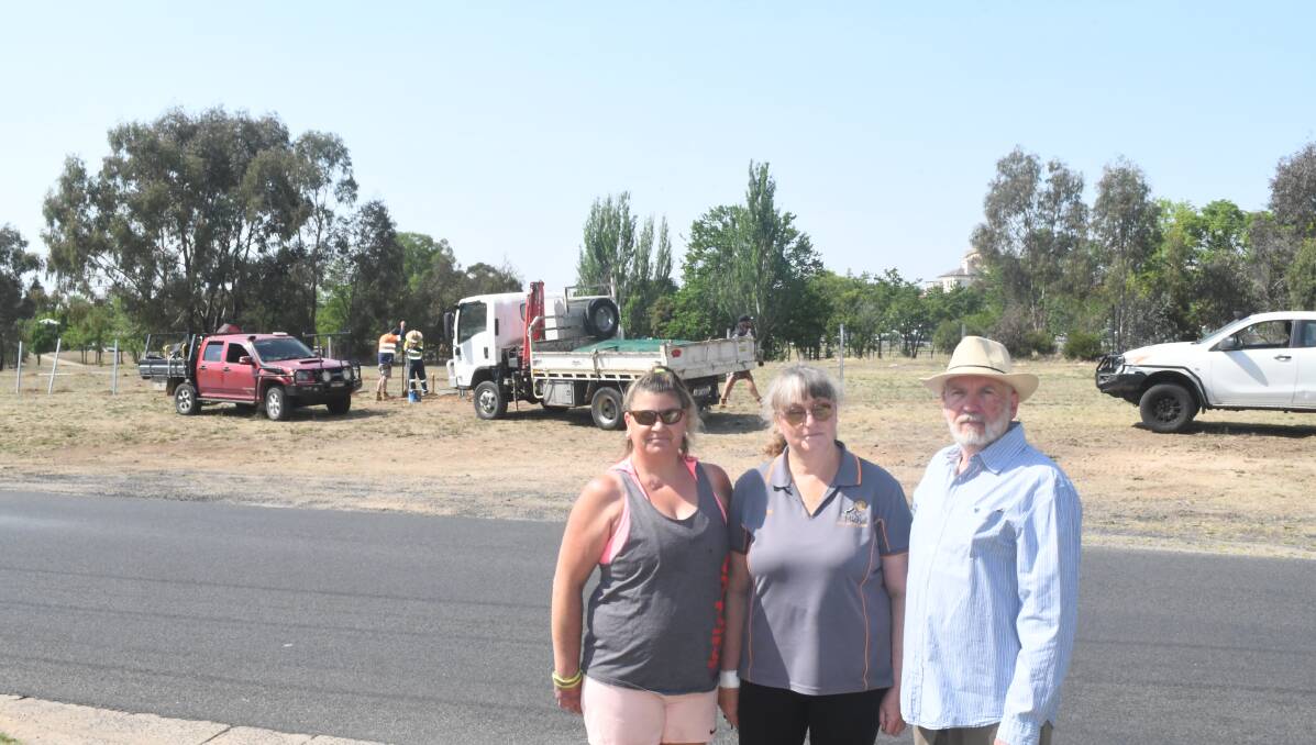 NOT HAPPY: Rocket Street residents Sonia Scott, Nicole Artery and Paul Phinn across the road from a dog park being built using drought stimulus funds.