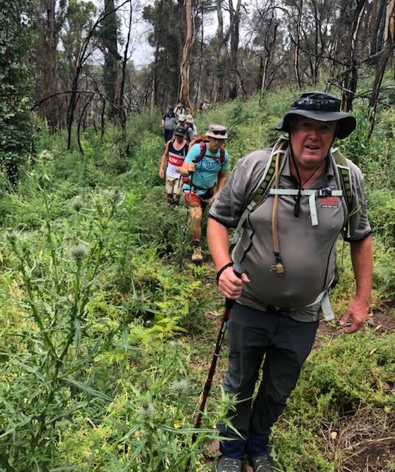 THIS WAY: Bathurst Greyhound Racing Club manager Jason Lyne leads the pack up Mount Canobolas ahead of a trek in Papua New Guinea in April. Photo: SUPPLIED. 