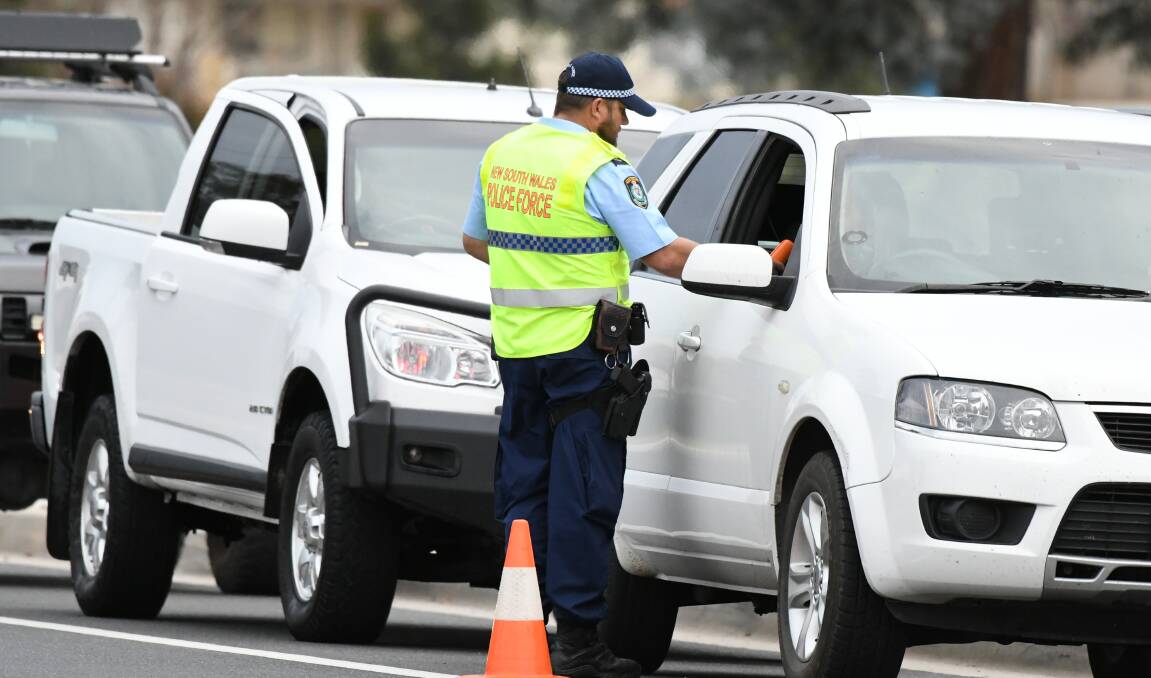CLOSE EYE: Police conduct random breath tests on Saturday afternoon on Hereford Street. Photo: CHRIS SEABROOK 060819crbt1