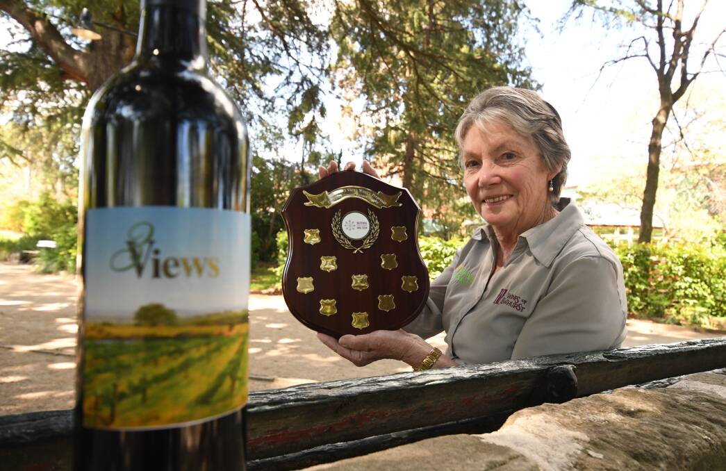 TASTE OF SUCCESS: Ruth Anderson from Three Views Vineyard with her silver medal-winning 2013 Cabernet Malbec Merlot at the National Cool Climate Wine Show. Photo: CHRIS SEABROOK 102218c3views1