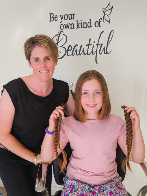 LONG AND SHORT OF IT: Hairdresser Brooke Moore from Ravensworth Hair Studio and Eden Kauter after her charity haircut.
