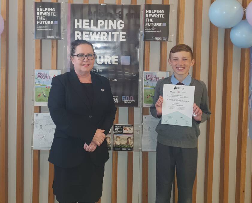 Bathurst Newcastle Permanent branch manager Adele Baldwin and St Philomena's Primary year five student Cruz Monaghan.