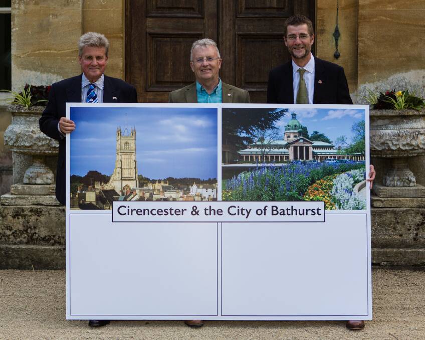 POP IT IN THE POST: Earl Bathurst, Andy Lennard of the Cirencester Community Development Trust and Cr Mark Harris of Cirencester Town Council with a giant postcard which will be sent to Bathurst.