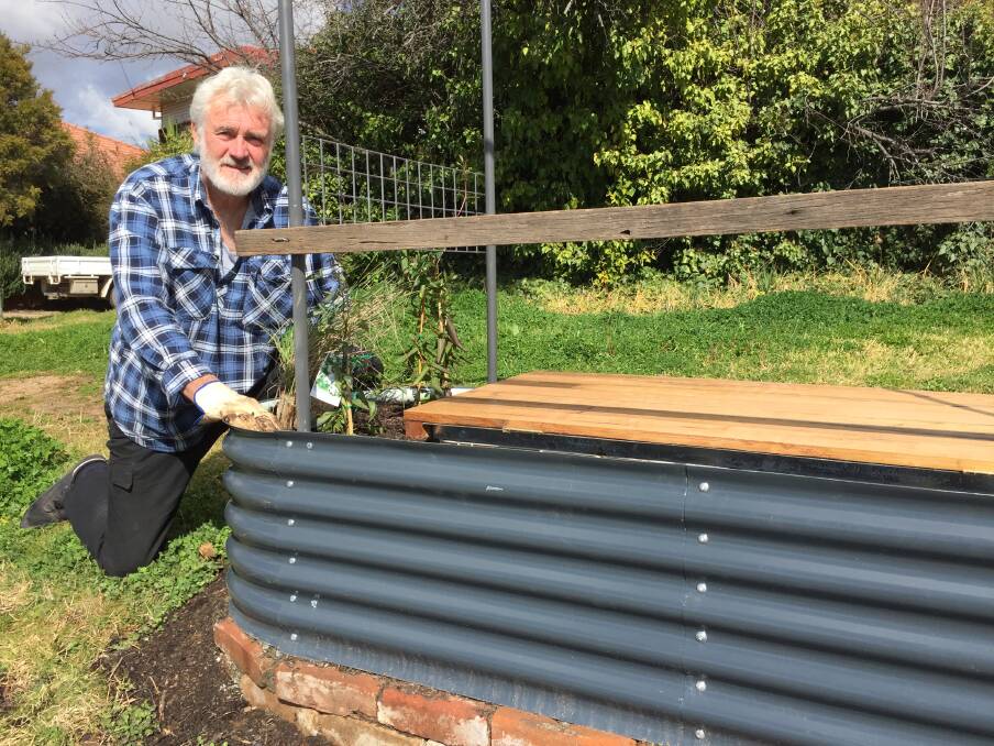 MULTI-PURPOSE: Councillor John Fry with the compost unit, garden bed and street seat that will be rolled out in the CBD in a trial.