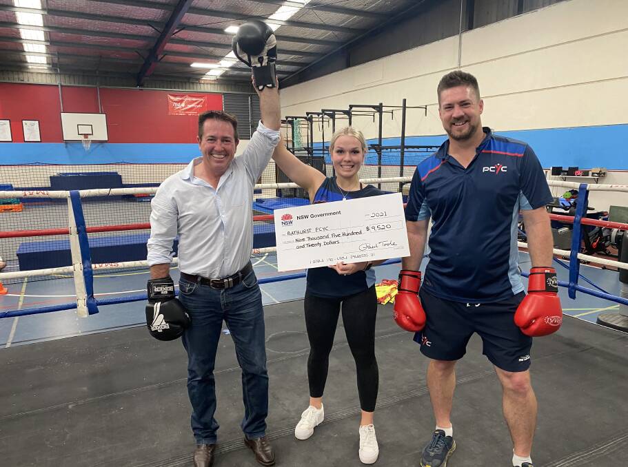 FIGHTING SPIRIT: Member for Bathurst Paul Toole at Bathurst PCYC with Lauren Clemens and club manager David Hitchick.