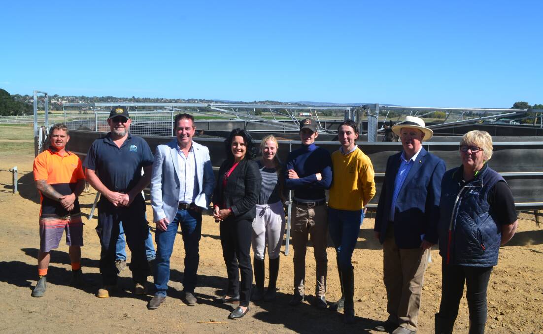 INVESTMENT: Member for Bathurst Paul Toole and Bathurst Thoroughbred Racing general manager Michelle Tarpenning (third and fourth from left) with the new horse-walker at Tyers Park.