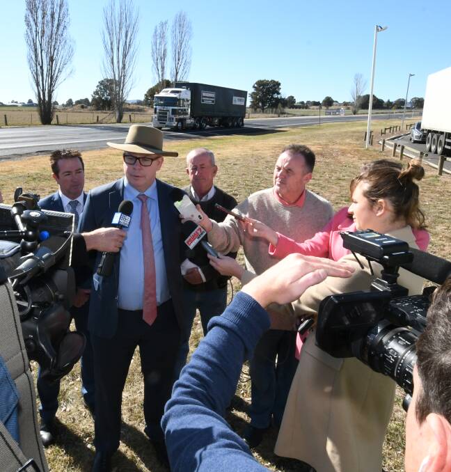 ON THE ROAD: RMS western region director Alistair Lunn addresses the media on Tuesday. Also pictured are Bathurst MP Paul Toole and deputy mayor Bobby Bourke. Photo: CHRIS SEABROOK 072319cupgrade2