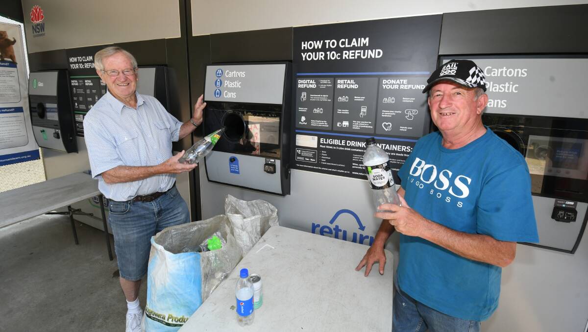 SUCCESS: Jim Grives and mayor Bobby Bourke at the Community Op Shop's Return and Earn reverse vending machine. Photo: CHRIS SEABROOK 121019ccashcans1