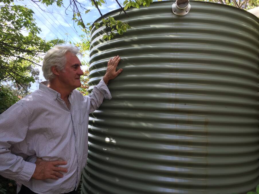 GO WITH THE FLOW: Councillor John Fry had a 10,000 litre tank installed at his home recently and uses the water for his garden and lawns. 