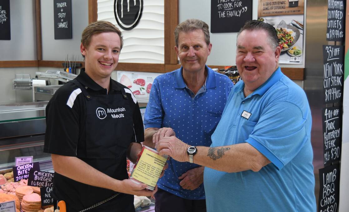 GIVE A LITTLE: Ben Smith from Mountain Meats with John Hollis and Les May from the Bathurst CPSA and one of the fundraising tins.