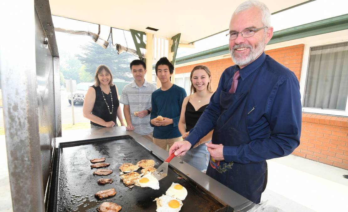WHAT'S COOKING: Senior school director Tracey Leaf, Brian Liang, Ricky Chen, Abbey Miller and head of academic excellence Greg Jones. Photo: CHRIS SEABROOK 121719cscots