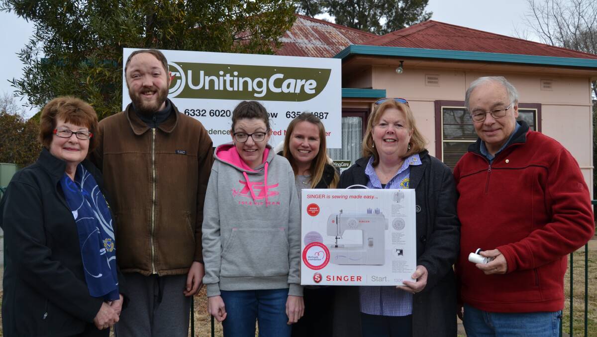 CARE PACKAGE: Licia Thomas (left), Sue Longmore and Michael Ryan (both right) from the Lions Club of Bathurst Macquarie with Ryan Taylor, Rebecca Armstrong and Uniting Care supervisor Kelly Dwyer.