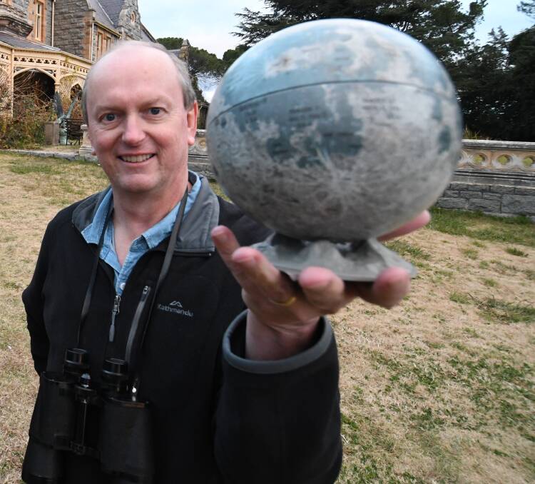 WORLD IN HIS HAND: Well-known local astronomer Ray Pickard will give a talk on Mars, which will soon be in direct line with Earth.