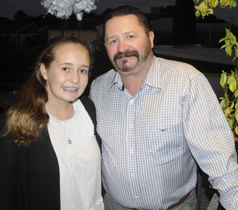 FATHER AND DAUGHTER: Katie Cuzner with her dad Darrin. 022517cwed5