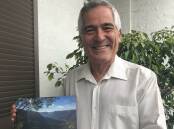 NEW CHAPTER: Author and geophysicist Peter Hatherly with his new book on the landscapes of the Blue Mountains.