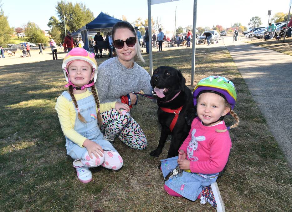 FAMILY FUN: Ange Coulter, her daughters, Zahlia, 6, and Mischa, 3, and Lexi the Labrador at last year's Million Paws Walk at Bathurst. Photo: CHRIS SEABROOK