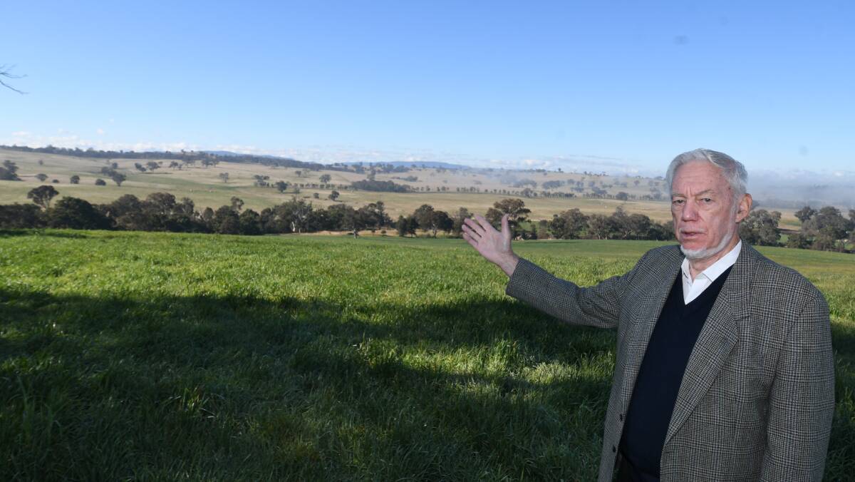 CONCERNED: Lachlan Rendall showing the valley in the middle distance where the intended solar farm is to be placed. Photo: CHRIS SEABROOK 063020csolarfm1