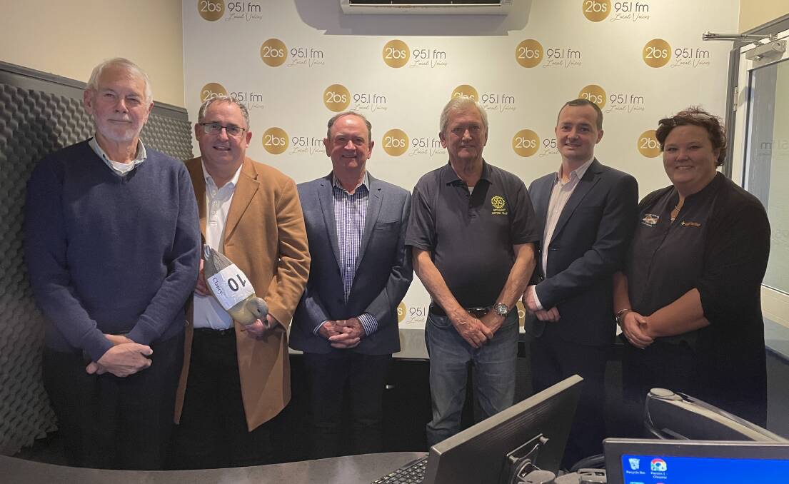 Rotary Club of Bathurst's Iain McKean (third from left) in December last year during the distribution of proceeds from the club's Great Corporate Duck Race. 
