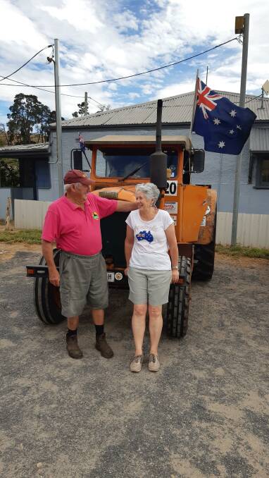 FLAG FLYING: Sally and Denis Coops drove to the Australia Day celebrations at Metro Perthville in their Chamberlain 9G tractor with our national flag.