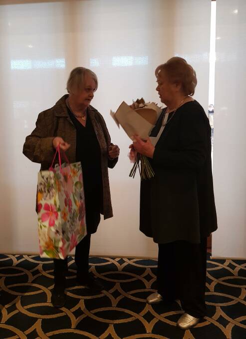 THANK YOU: Former Macquarie Care Centre residential manager Sharyn Ryan presents long-time president Beverley Stuart with gifts from members of the auxiliary. Photo: SUPPLIED