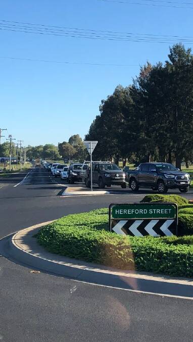 LONG WAIT: Traffic banked up at the roundabout at the Trinity Heights shops.