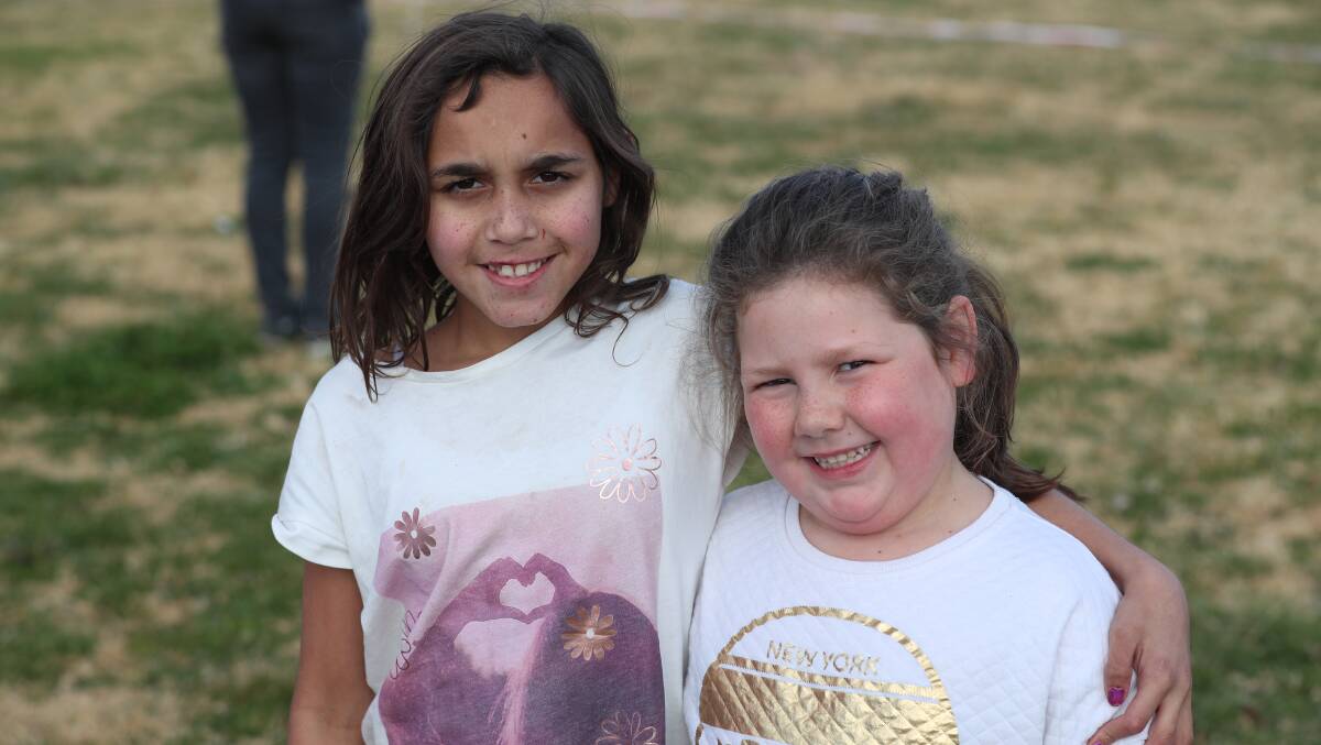 FUN TIMES: Kiara Edwards and Kaira Mackay enjoying the family fun day out at the Kelso Community Hub. Photo: PHIL BLATCH