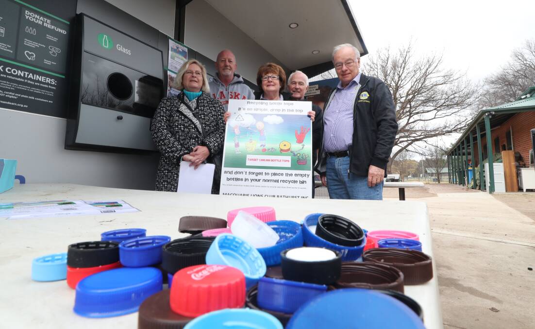 TOP OF MIND: Macquarie Lions members Tracey and Glenn Phillips, Roger and Licia Thomas and Michael Ryan want bottletops. Photo: PHIL BLATCH