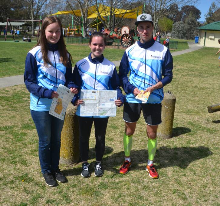 MAP IT OUT: Orienteering NSW team members Joanna Hill, Clare Jessup and Konstan Nanhanen in Bathurst the last time the sport came to the region. Photo: BRADLEY JURD