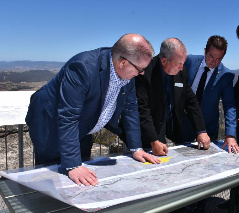 BIG IDEA: Transport for NSW western region director Alistair Lunn, mayor Bobby Bourke and MP Paul Toole looking at plans for the highway duplication last year.