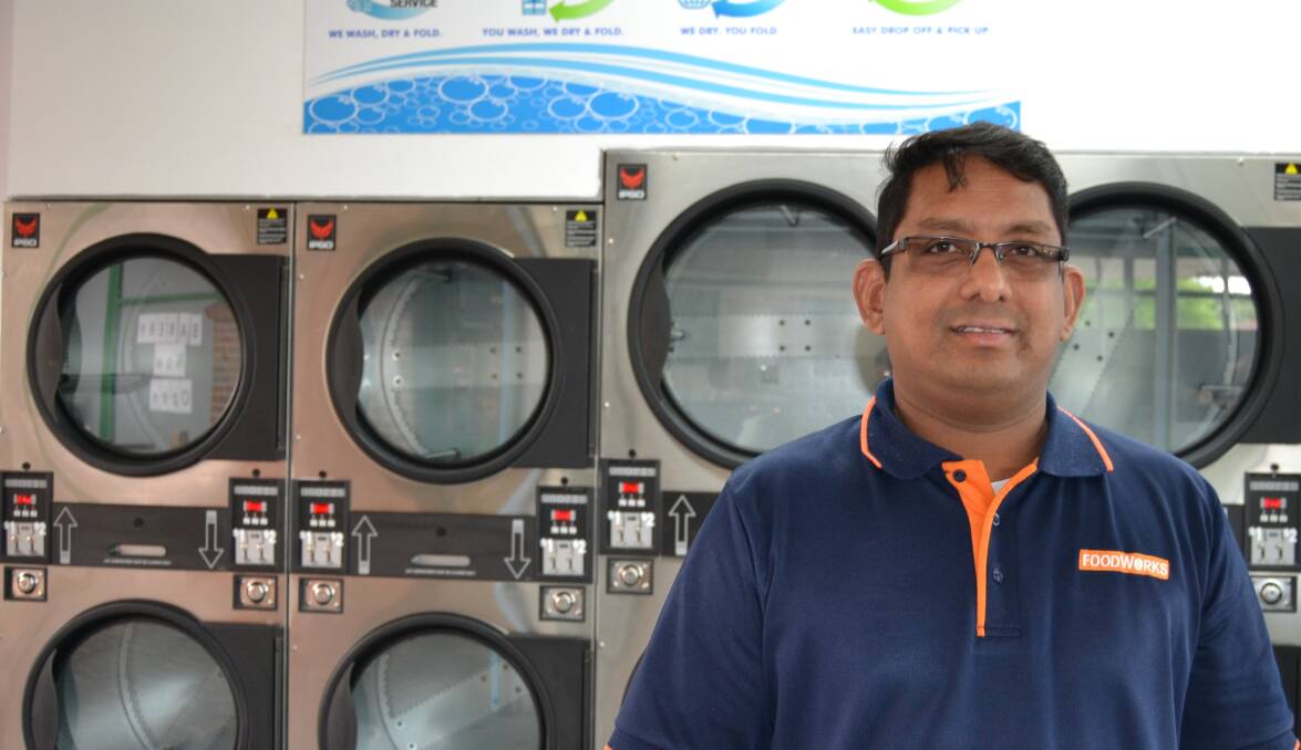 SPIN CYCLE: Kelso Centrepoint owner Praba Kulasegaram inside the centre's newly reopened laundrette. It's believe the laundrette has been closed for 15 years or more.