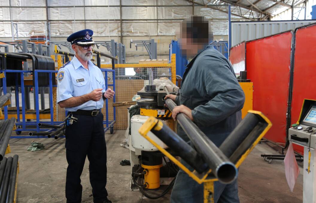 LEARNING: Kirkconnell Correctional Centre corrective services industries manager Anthony Tait and an inmate. Products such as gates and furniture are produced at the centre.
