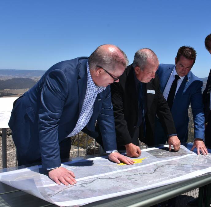 BLUEPRINT: Transport for NSW's Alistair Lunn, Bathurst mayor Bobby Bourke and Bathurst MP Paul Toole look at plans for the Great Western Highway upgrade.