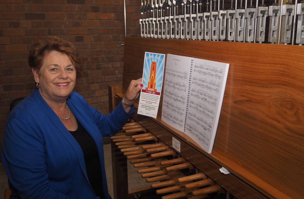 CHIMING IN: Local carillonist Denise Garland at the clavier inside the Bathurst War Memorial Carillon earlier this year. Photo: SAM BOLT