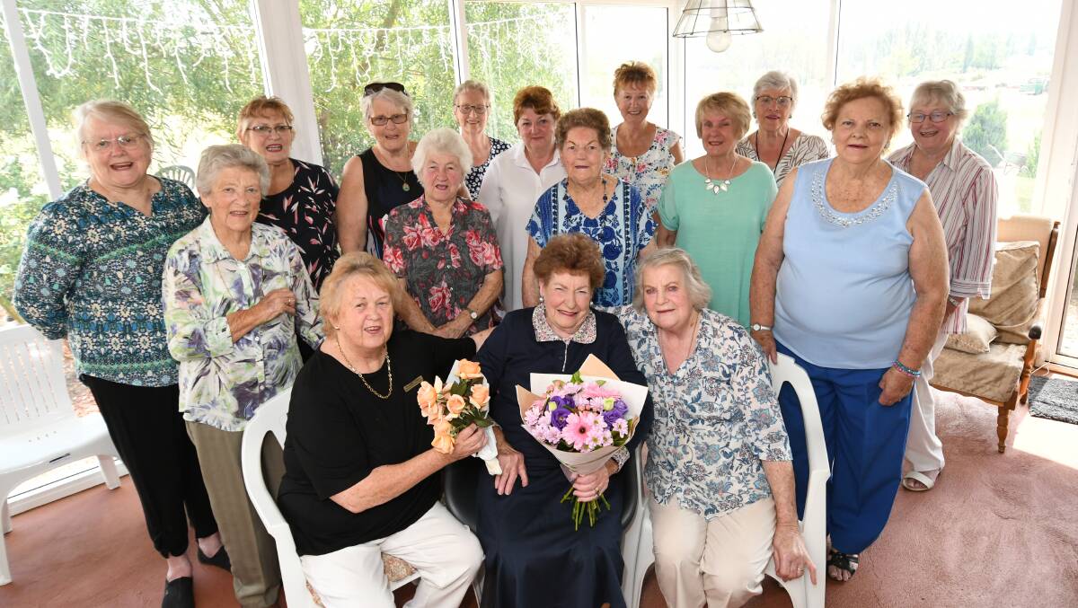 RECOGNISED: Macquarie Care Centre Auxiliary president Beverley Stuart, retiring member Maisie Scott and event organiser Kay Hotham (front) surrounded by auxiliary members. Photo: CHRIS SEABROOK 022719cmaisie