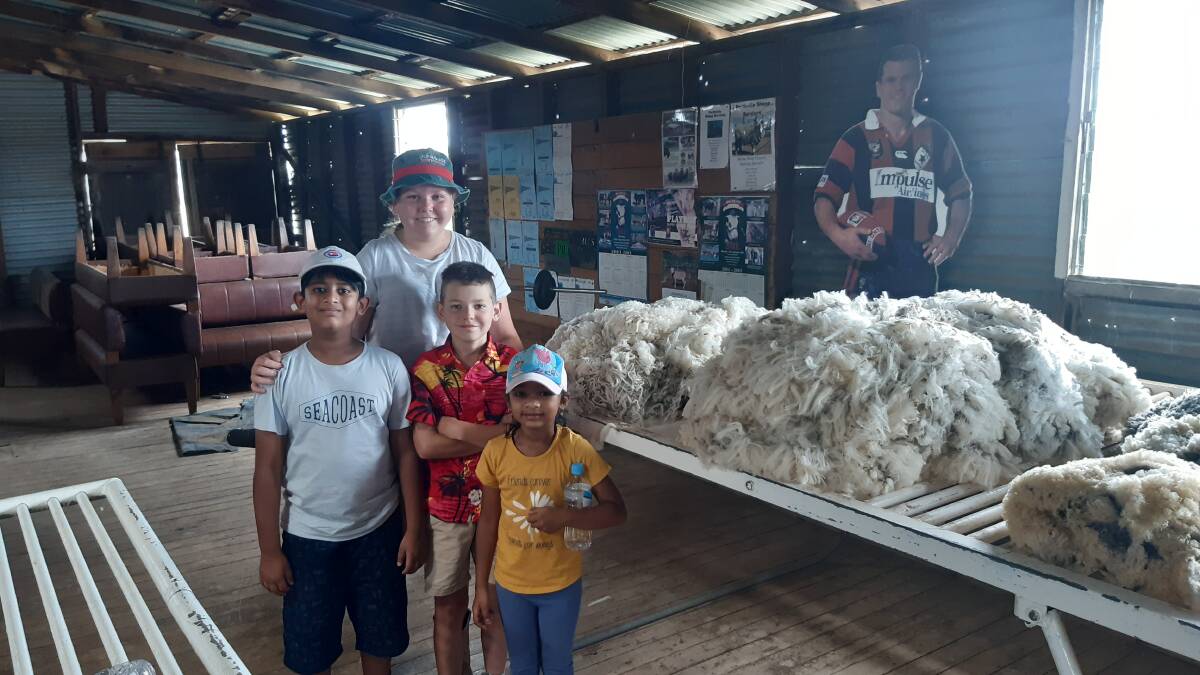 OUT AND ABOUT: Rijhik and Sreeja from Metro Perthville with Sami and Tom Seaman enjoyed a trip to the farm and saw some nice fleeces and a cutout of former Newcastle star Paul Harragon.