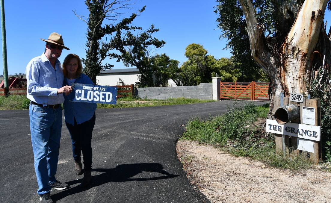 ROAD BLOCK: Toby and Sue Jones in the upgraded driveway of their property The Grange on O'Connell Road.
