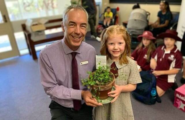 BIG IDEA: Bathurst West Public School principal Darren Denmead and Violet Bannister-Tyrell and her potted plant. 
