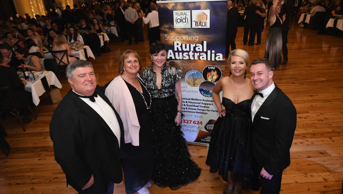 FUNDRAISING: Rural Aid founder Charles Alder, his wife Tracy, Em Rusciano, Chezzi and Grant Denyer at the Black Tie and Boots Ball on Saturday. Photo: CHRIS SEABROOK 