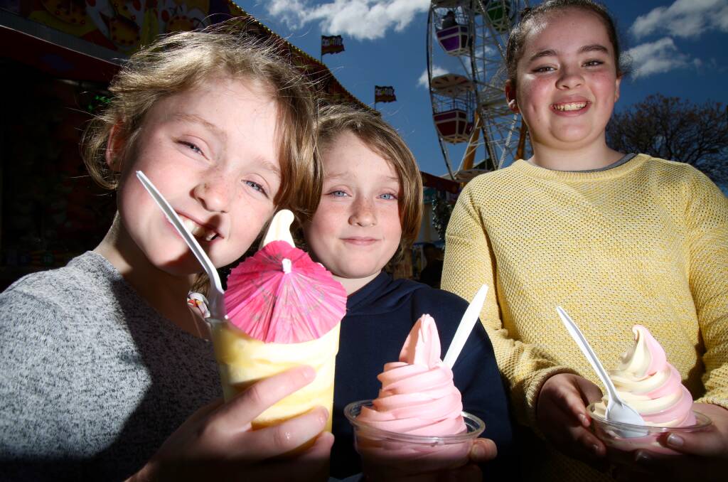 A FUN TIME: Willow and Faith Evans, with Lauren Foster, at the Bathurst Fun Fair on Saturday. Photo: PHIL BLATCH