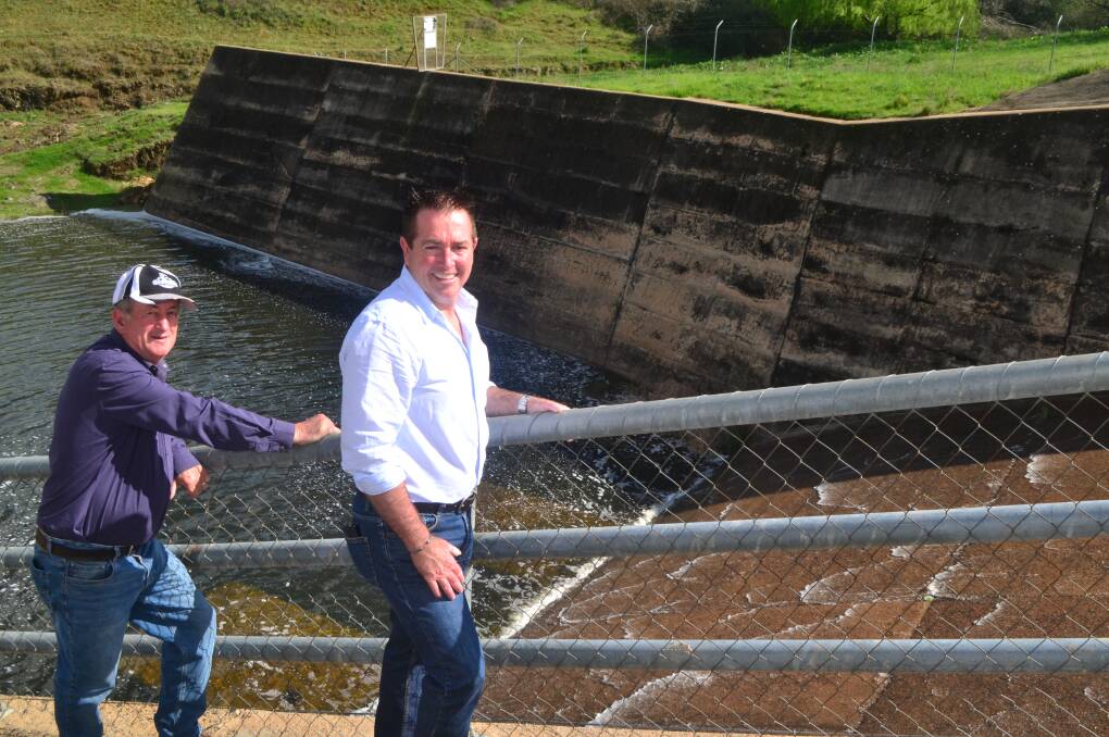 GREAT NEWS: Mayor Bobby Bourke and Bathurst MP Paul Toole watching water flow down the spillway at Ben Chifley Dam on Monday morning. Photo: MURRAY NICHOLLS