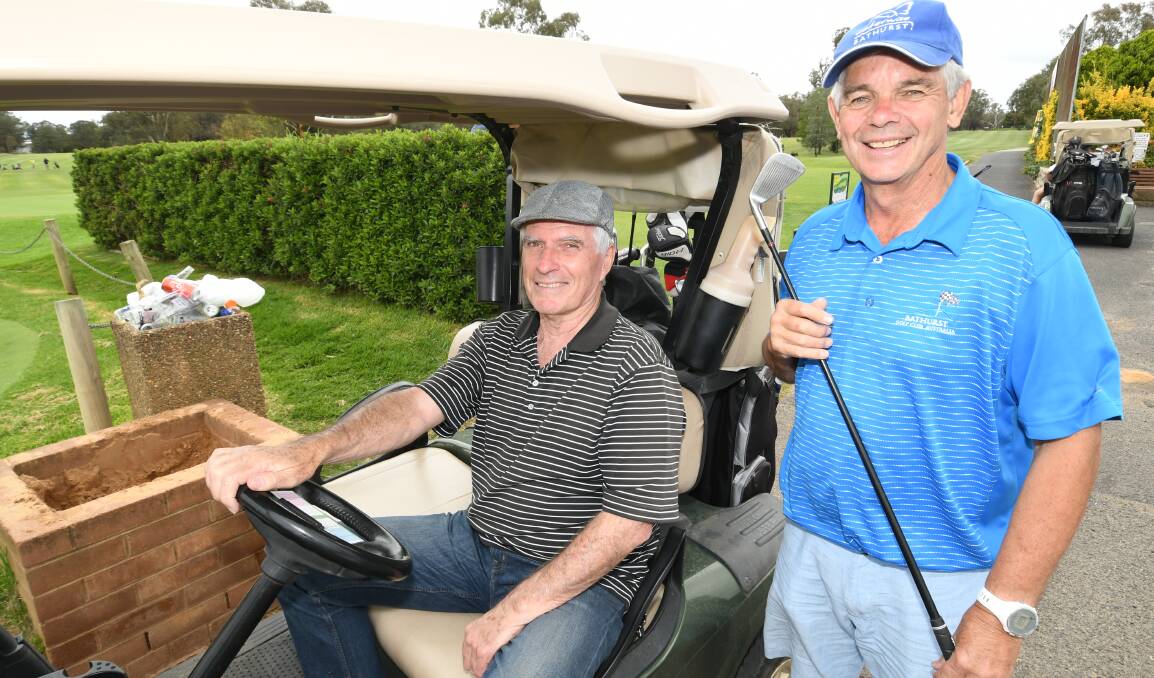 ON COURSE: Ian Wallace and Ray Stapley at last year's golf day. Mr Stapley went the closest to claiming the hole-in-one prizemoney.